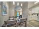 Elegant dining space with modern pendant lights and seamlessly connected to the open floorplan at 702 Gran Bahama Blvd, Davenport, FL 33897