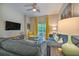 Comfortable living room showcasing modern decor, natural light, and a ceiling fan at 702 Gran Bahama Blvd, Davenport, FL 33897