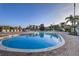 A spacious community pool surrounded by lounging chairs, with clear blue water at 702 Gran Bahama Blvd, Davenport, FL 33897