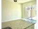 Bright, open-concept kitchen featuring granite countertops and sliding door access to backyard at 7562 Sunflower Cir, Kissimmee, FL 34747