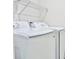 Efficient laundry area with modern Samsung washer and dryer units at 7562 Sunflower Cir, Kissimmee, FL 34747