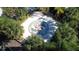 Aerial view of a splash pad with a colorful spiral design surrounded by palm trees at 7564 Sunflower Cir, Kissimmee, FL 34747