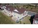 Two-story townhome features a private patio, manicured lawn, and rear parking at 7564 Sunflower Cir, Kissimmee, FL 34747