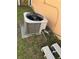 Exterior AC unit with greenery nearby, next to a home's peach-painted wall at 804 Carrousel Ln, Kissimmee, FL 34759