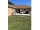 A spacious backyard with a patio set and grill, ideal for outdoor entertaining at 804 Carrousel Ln, Kissimmee, FL 34759