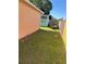 A grassy side yard with a shed, trailer, and fence, showcasing outdoor space at 804 Carrousel Ln, Kissimmee, FL 34759