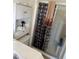 Compact bathroom featuring a shower with sliding glass doors, storage cabinet, and standard toilet at 804 Carrousel Ln, Kissimmee, FL 34759