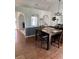 Dining room with wood floors, a table for four, and decorative archways with natural light at 804 Carrousel Ln, Kissimmee, FL 34759