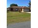 Charming single-story home with a well-manicured lawn, two-car garage, and a neatly landscaped yard at 804 Carrousel Ln, Kissimmee, FL 34759