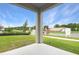 View from back porch; see professionally landscaped yard and community signs at 804 Lake Dell Rd, Dundee, FL 33838