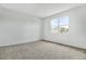 Bright bedroom featuring plush carpet, neutral paint, and ample natural light at 804 Lake Dell Rd, Dundee, FL 33838