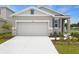 Charming single-story home with a two-car garage and well-manicured lawn at 804 Lake Dell Rd, Dundee, FL 33838