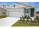 Charming single-story home with a two-car garage and well-manicured lawn at 804 Lake Dell Rd, Dundee, FL 33838