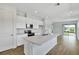 Modern kitchen with a large island, stainless steel appliances, and white cabinetry at 804 Lake Dell Rd, Dundee, FL 33838