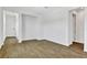 Bright living room featuring wood-look tile flooring and neutral paint at 804 Lake Dell Rd, Dundee, FL 33838