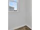 Corner view showing baseboard, flooring and double hung window at 804 Lake Dell Rd, Dundee, FL 33838