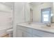 Bathroom featuring double sink vanity with granite countertop and shower-tub combo at 808 Lake Dell Rd, Dundee, FL 33838