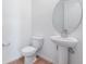 Bathroom featuring a toilet and pedestal sink at 808 Lake Dell Rd, Dundee, FL 33838
