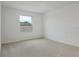 Bedroom featuring carpet, a window, and electrical outlets at 808 Lake Dell Rd, Dundee, FL 33838