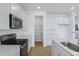 Bright modern kitchen featuring stainless steel appliances, an island and a pantry at 808 Lake Dell Rd, Dundee, FL 33838