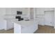 Bright modern kitchen featuring an island, stainless steel appliances, and ample cabinet space at 808 Lake Dell Rd, Dundee, FL 33838