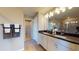 Modern bathroom showcasing double sinks and a well-lit vanity area at 812 Lake Dell Rd, Dundee, FL 33838