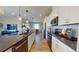 This modern kitchen features an island, stainless steel appliances, neutral countertops and recessed lighting at 812 Lake Dell Rd, Dundee, FL 33838