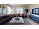 Bright living room featuring stylish furnishings, modern decor, and a large window with natural light at 812 Lake Dell Rd, Dundee, FL 33838
