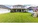 Expansive backyard with well-manicured lawn and fencing, providing ample space for recreation and privacy at 8228 Randal Park Blvd, Orlando, FL 32832