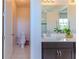 Bathroom featuring single vanity with quartz countertops and a toilet at 8228 Randal Park Blvd, Orlando, FL 32832