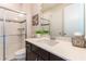 Modern bathroom with walk-in shower with glass doors and vanity with countertop at 8228 Randal Park Blvd, Orlando, FL 32832
