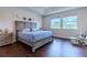 Bedroom with king bed, ample natural light, and tray ceiling at 8228 Randal Park Blvd, Orlando, FL 32832
