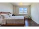 Bright bedroom with a queen bed and large window at 8228 Randal Park Blvd, Orlando, FL 32832