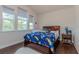 Bedroom featuring hardwood floors, large windows and a -themed bed at 8228 Randal Park Blvd, Orlando, FL 32832
