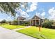 Beautiful clubhouse exterior with stone accents, manicured landscaping, and a welcoming entrance at 8228 Randal Park Blvd, Orlando, FL 32832