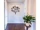 Entryway with Gathering tree wall decor and wood flooring at 8228 Randal Park Blvd, Orlando, FL 32832