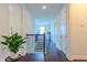 Upstairs hallway with wood floors, linen closet and staircase at 8228 Randal Park Blvd, Orlando, FL 32832