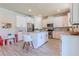 Kitchen featuring white cabinets, stainless steel appliances, and an island with seating at 8228 Randal Park Blvd, Orlando, FL 32832