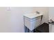 Laundry room sink with metal faucet and decor at 8228 Randal Park Blvd, Orlando, FL 32832