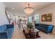Open-concept living room showcasing kitchen and elegant decor at 8228 Randal Park Blvd, Orlando, FL 32832