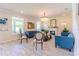Elegant living room with fireplace, comfortable sofas and chandelier at 8228 Randal Park Blvd, Orlando, FL 32832
