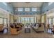 Elegant lounge with comfortable seating, chandeliers, and scenic views creating a sophisticated and inviting atmosphere at 8228 Randal Park Blvd, Orlando, FL 32832
