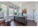 Well-lit office space with rich wood flooring, modern desk setup, and ample natural light from large windows at 8228 Randal Park Blvd, Orlando, FL 32832
