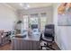 Comfortable office with wood floors, large windows and plenty of space to work from home at 8228 Randal Park Blvd, Orlando, FL 32832