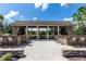 Outdoor pavilion with bar, seating, and picnic tables providing a perfect space for entertaining and relaxation at 8228 Randal Park Blvd, Orlando, FL 32832