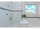 Shower featuring tile, glass enclosure and shower head, with a separate soaking tub at 8228 Randal Park Blvd, Orlando, FL 32832