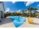 Fun splash pad area with colorful water features and lounge chairs, perfect for Gathering entertainment at 8228 Randal Park Blvd, Orlando, FL 32832
