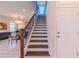 Beautiful staircase with hardwood steps and iron railing detail at 8228 Randal Park Blvd, Orlando, FL 32832
