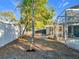 A peaceful backyard view showcases the well-maintained landscape with access to the refreshing pool area at 905 W 11Th Ave, Mount Dora, FL 32757