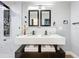 Modern bathroom featuring double vanity, dual mirrors and walk-in shower at 905 W 11Th Ave, Mount Dora, FL 32757